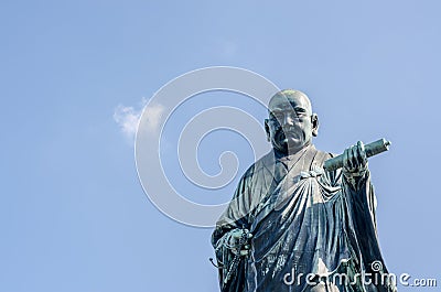 FUKUOKA, JAPAN - NOVEMBER 6: The bronze statue of Nichiren Shonin a founder of Nichiren School, a school of Buddhism in japan Editorial Stock Photo