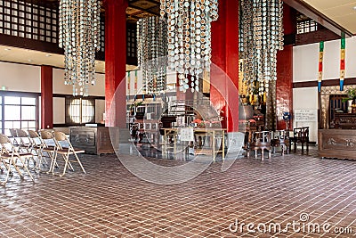 Fukusai-ji buddhist temple in Nagasaki, interior view of prayer hall, altar and traditional decorations, Japan Stock Photo