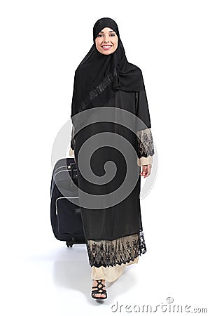 Full body of an arab saudi woman traveler walking Stock Photo