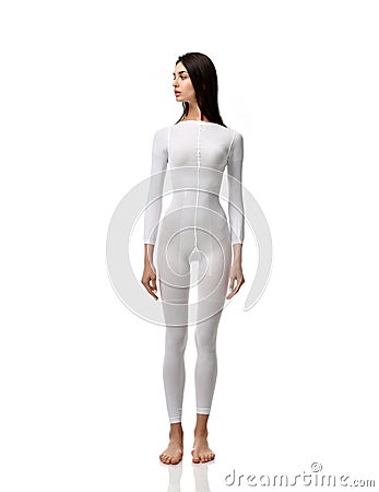 Full body brunette woman in white single use suit cloth ready for medical science research experiment full length Stock Photo