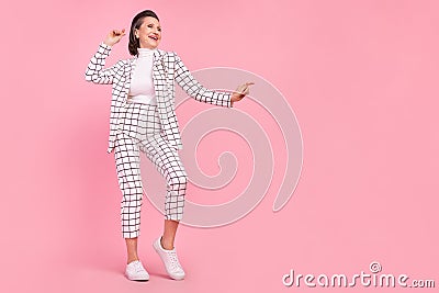 Full body image lady dancing relaxing wear white checkered suit clubber on pink color background Stock Photo