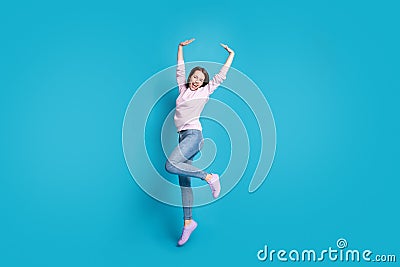 Full body photo of energetic enthusiastic girl enjoy season discount free time jump raise hands wear good look mood Stock Photo