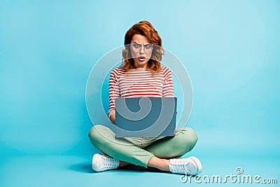 Full body photo of frustrated girl sit crossed work computer read social media information impressed scream unbelievable Stock Photo