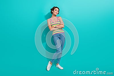 Full body photo of minded stunning lady folded hands look empty space fantasize isolated on teal color background Stock Photo