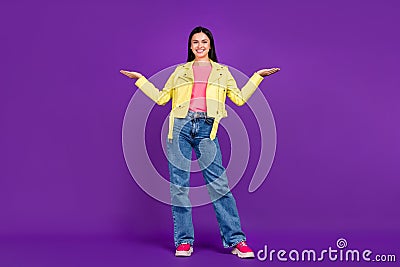 Full body photo of young cheerful girl promoter hold hands proposition vs scales measure ads isolated over violet color Stock Photo