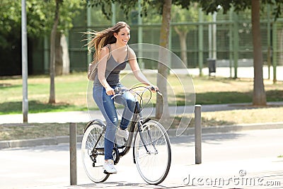 Full body portrait of a cyclist riding in the street Stock Photo