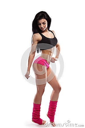 Full body portrait of slim attractive fitness female in pink sportswear Stock Photo