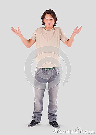 Full body portrait of young Man standing with grey background Stock Photo