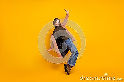 Full body profile photo of cheerful pretty lady dancing strange modern youth moves wear casual pink coat knitted Stock Photo