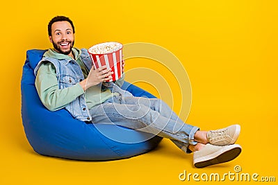 Full body size photo of latin funky guy lying beanbag cinema watch premiere new avatar film eat popcorn isolated on Stock Photo