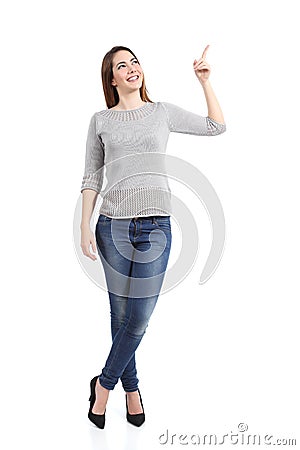 Full body of a standing casual woman pointing at side Stock Photo