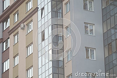 Parts of facades of multi-storey buildings. New buildings. Stock Photo