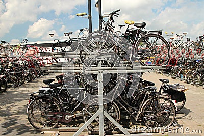 Full double deck parking place for bicycles at the railroad station of Zwolle in the Netherlands Editorial Stock Photo