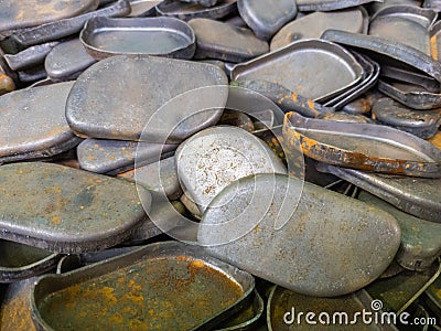 full frame background of many stamped parts made of sheet metal with draw operation Stock Photo