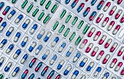 Full frame of colorful antimicrobial capsule pills. Quality control error in pharmaceutical manufacturing. Stock Photo