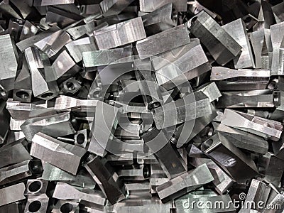 full frame industrial background of pile of shiny steel flat grinded parts Stock Photo