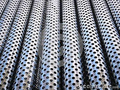 Full Frame Background of Shiny Decorative Perforated Stainless Steel Tubes Stock Photo