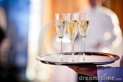 Full glasses of champagne on tray Stock Photo