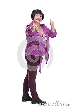 in full growth.happy senior woman with keys in hand. Stock Photo