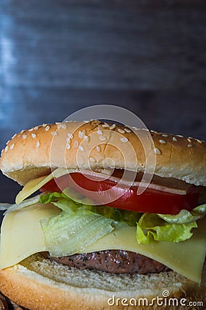 Full hamburguer on rustic background Stock Photo