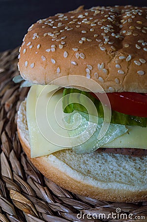 Full hamburguer on rustic background Stock Photo