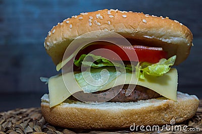 Full hamburguer on rustic background Stock Photo