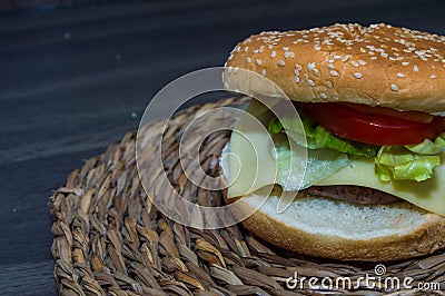 Full hamburguer on rustic background Stock Photo