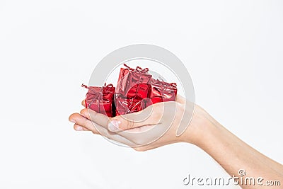 Full hands of small presents Stock Photo