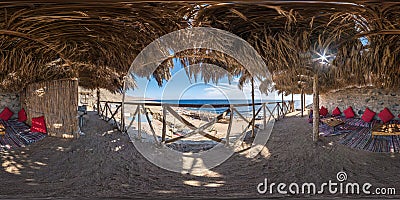 Full hdri seamless spherical 360 panorama thatched hut with daybeds and cushions for relaxing or palm tree hut on Red Sea coast in Stock Photo