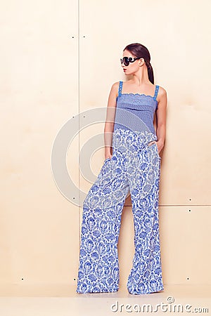 Full height portrait of a young woman in pantsuit Stock Photo