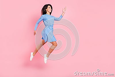 Full lenght profile side photo of young girl happy positive smile run hurry sale jump up isolated over pink color Stock Photo