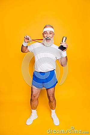 Full length of active crazy comic emotional cool grandpa holding Stock Photo