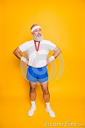 Full length of active modern cool funny grandpa with arms on waist. Stock Photo