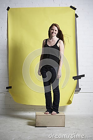 Full length against yellow background Stock Photo