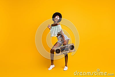 Full length body size photo of black skinned girl cassette recorder listening music enjoying party isolated on bright Stock Photo