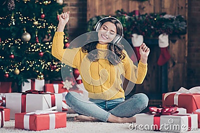 Full length body size photo of charming nice cute girl wearing yellow jumper jeans denim listening to music sitting on Stock Photo