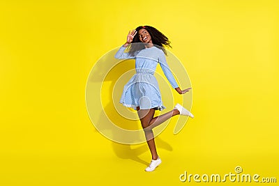 Full length body size photo of dancing girl in blue dotted dress looking empty space relaxing at party bright Stock Photo