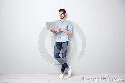 Full length body size photo of focused serious intelligent coworking manager standing confidently with legs crossed Stock Photo