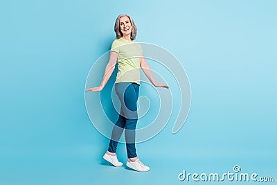 Full length body size photo senior business woman walking forward cheerful isolated pastel blue color background Stock Photo