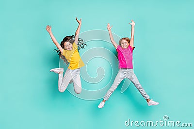 Full length body size photo of two young winning casual models overjoyed with some good news while isolated with teal Stock Photo