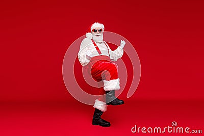 Full length body size view of handsome cheerful cheery funny bearded Santa dancing enjoying rest festal day celebratory Stock Photo