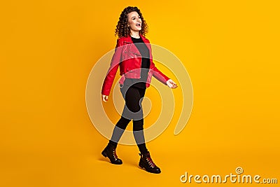 Full length body size view of her she nice pretty cheerful wavy-haired girl strolling going isolated on bright yellow Stock Photo