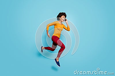 Full length body size view of nice attractive cheerful motivated energetic wavy-haired girl jumping talking on cell Stock Photo