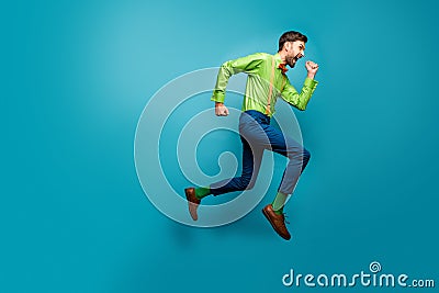 Full length body size view of nice attractive crazy energetic purposeful cheerful guy jumping running fast active Stock Photo