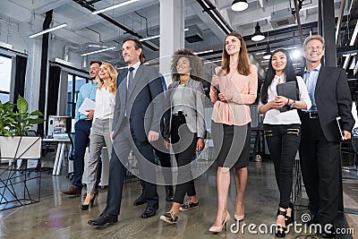 Full Length Business People Team Walking In Modern Office, Confident Businessmen And Businesswomen In Suits Diverse With Stock Photo