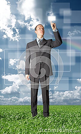 Full length businessman push the button outdoors Stock Photo