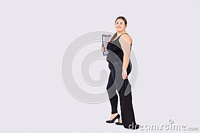 Full length large body size photo of cute business lady, holding clipboard documents papers. Ready for conference. High Stock Photo