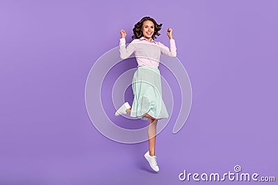 Full length photo of cool young brunette lady jump wear shirt skirt shoes isolated on purple background Stock Photo