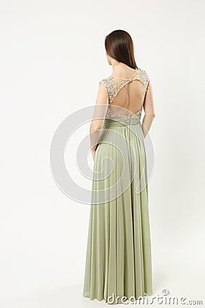 Full length photo of fashion model woman wearing elegant evening dress olive gown posing isolated on white wall Stock Photo