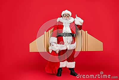 Full length photo of funny grey-hair snata think have creative spirit thoughts to deliver gifts on his craft turbo card Stock Photo